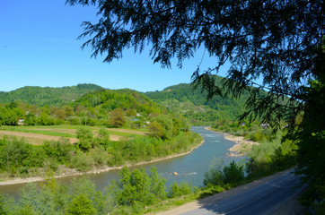 mountain river between sheer cliffs . blue clear water of the river.