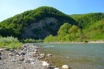 mountain river between sheer cliffs . blue clear water of the river.