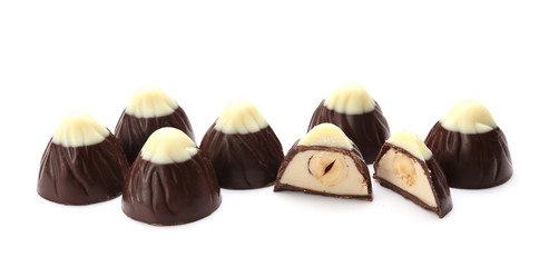Tasty chocolate candies on white background