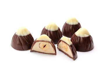 Tasty chocolate candies on white background