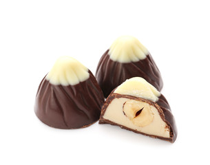 Tasty chocolate candies on white background