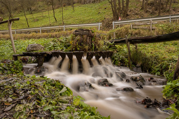 Obraz premium Traditional natural wash machine (valtoare) under a stream of water in Alba , Romania