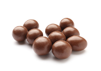 Tasty chocolate nuts on white background