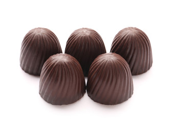 Tasty chocolate candies on white background