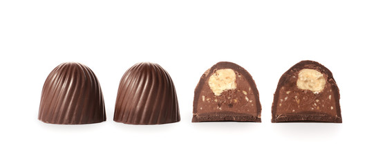 Tasty chocolate candies on white background