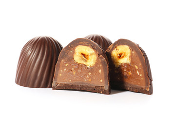 Tasty chocolate candies on white background