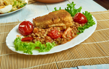 Harissa crumbed fish with lentils