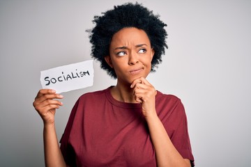 Young African American afro politician woman with curly hair socialist party member serious face...