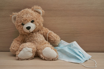 Teddy bear wearing mask, ideas concept for parents to convince children to wearing mask to protect the young children from catching Coronavirus COVID-19.
