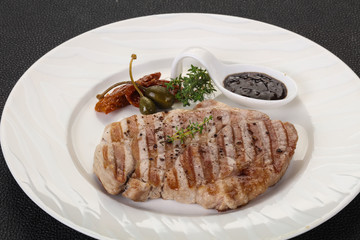Grilled pork steak with pepper sauce