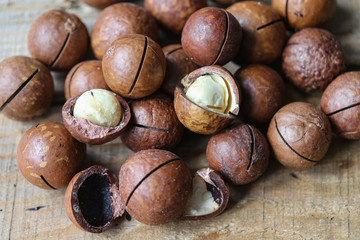 macadamia nuts on a wooden table macro photo