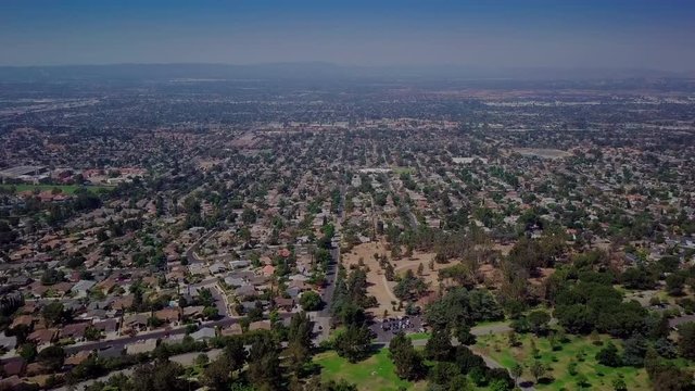 Porter Ranch aerial tracking approach over public park and suburban landscape. Shot on Mavic at 25fps