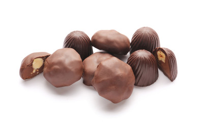 Tasty chocolate candies on white background