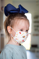 Child face with flu mask