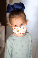 Child face with flu mask