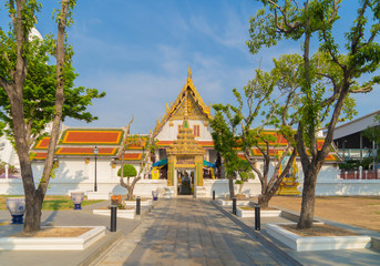 Wat Rakhang Khositaram, a Buddhist temple stupa at noon with blue sky in Bangkok city, Thailand....