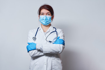 Doctor wearing surgical face mask and gloves.