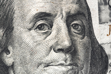 Close-up of one hundred bill Franklin portrait