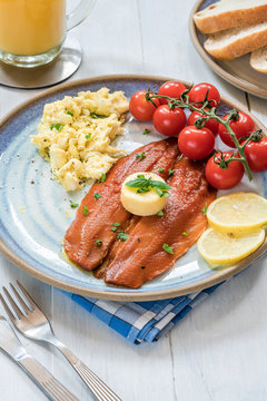Smoked kipper brunch with scrambled egg and tomatoes