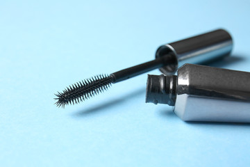 Black mascara on color background