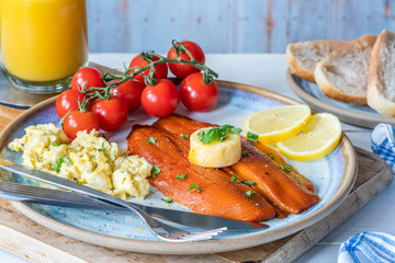 Smoked kipper brunch with scrambled egg and tomatoes