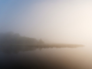 foggy morning on the river near the floodplain meadow