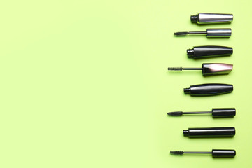 Black mascara on color background