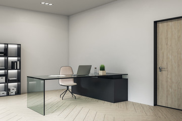 Modern manager workplace interior with laptop on glasses table.