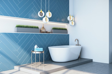 Luxury blue bathroom interior with bath