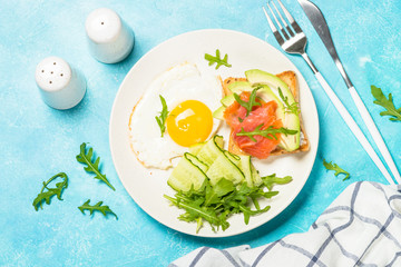 Healthy breakfast with egg, toast and salad.