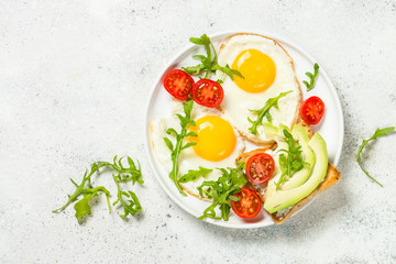 Healthy breakfast with egg, toast and salad.