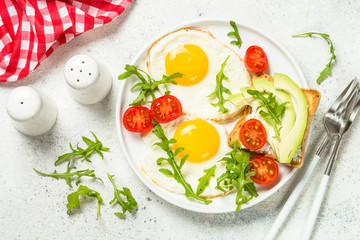Healthy breakfast with egg, toast and salad.