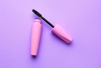 Black mascara on color background