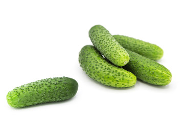 fresh organic cucumbers isolated on white background