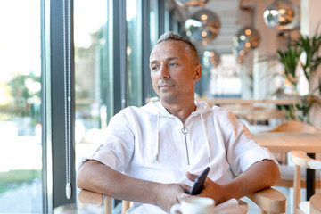 portrait of a handsome young man in a restaurant