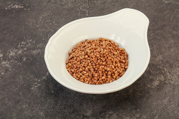 Raw buсkwheat cereal in the bowl