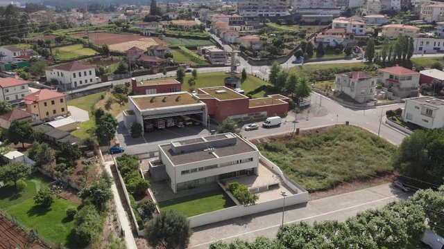 AERIAL DRONE FOOTAGE - The Santo Tirso Volunteer Firefighters Humanitarian Association fire station (Bombeiros Voluntarios Santo Tirso) in the district of Porto in Portugal.