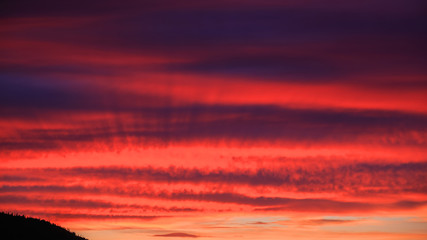 Dramatic red sunset sky in the sea