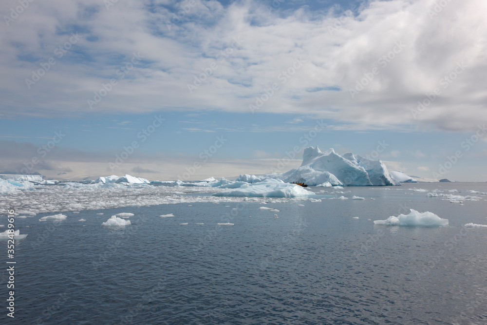 Sticker Antarctica landscape with iceberg on a cloudy winter day