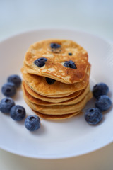 Blueberry Ricotta Pancakes on white wood background. toning. selective focus