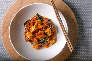 Homemade spicy pork belly cooked with kimchi, spring onions, onion and tofu. Marinated with red chilli paste called gojuchang.