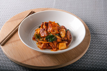 Homemade spicy pork belly cooked with kimchi, spring onions, onion and tofu. Marinated with red chilli paste called gojuchang.