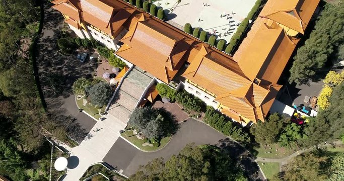 Facade of Nan Tien temple on green hill side in the middle of chinese garden around Wollongong.
