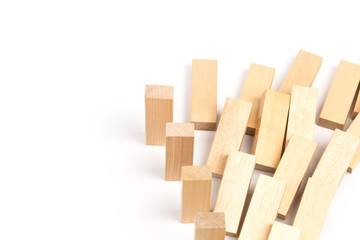 Domino effect, row of wood domino on white background