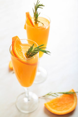 Glasses of tasty mimosa cocktail on table