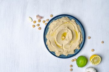 hummus on white kitchen table