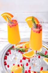 Glasses of tasty mimosa cocktail on table