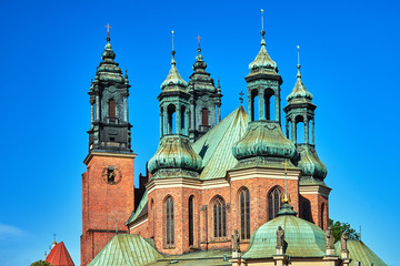 Fototapeta na wymiar Gothic belfries of the historic cathedral in Poznan.
