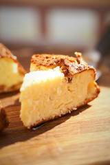 Cottage cheese casserole with raisins and semolina on wooden background Cottage cheese casserole