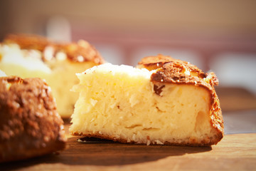 Cottage cheese casserole with raisins and semolina on wooden background Cottage cheese casserole